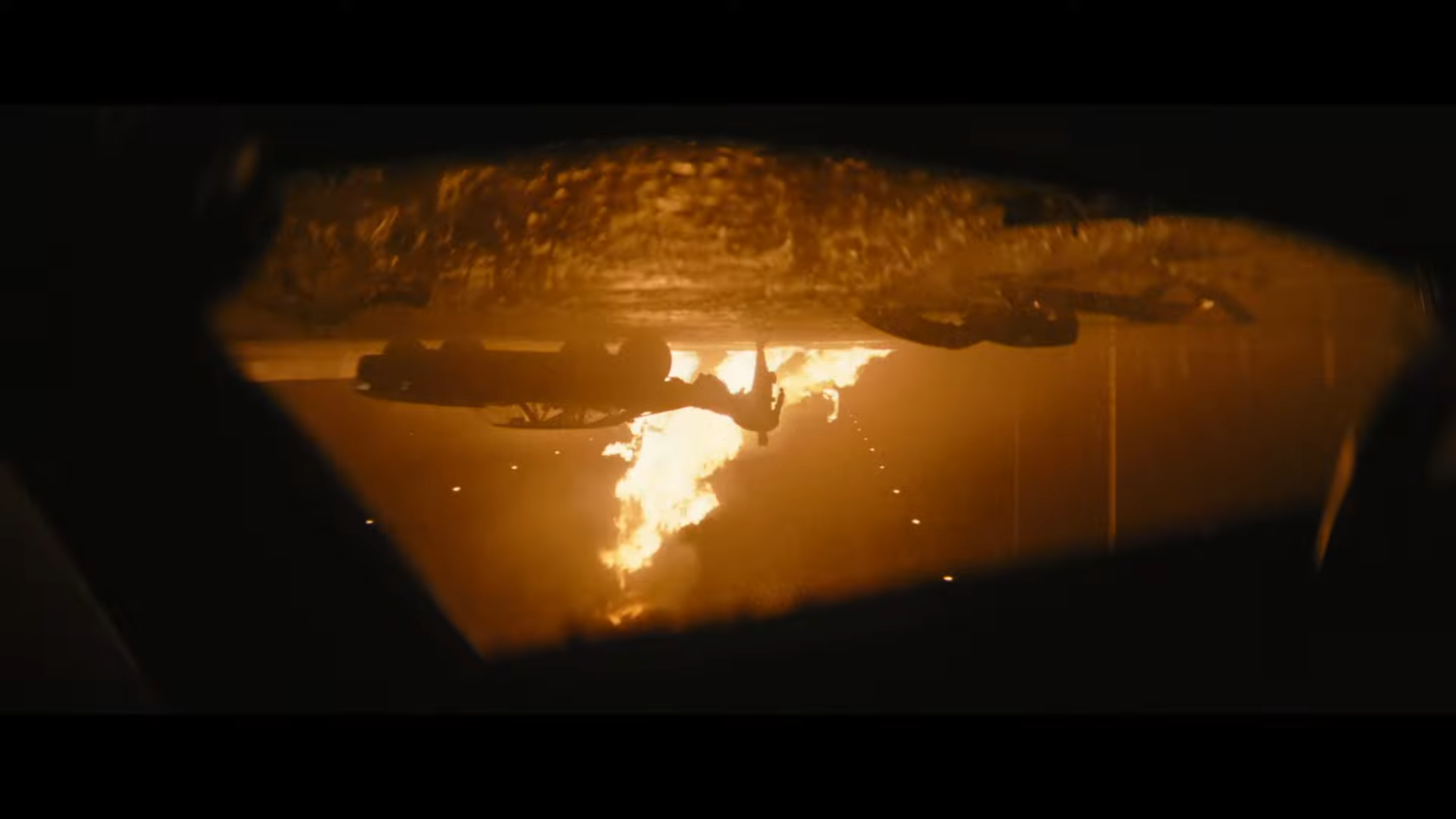 Alt: Batman walking towards an upside down car
