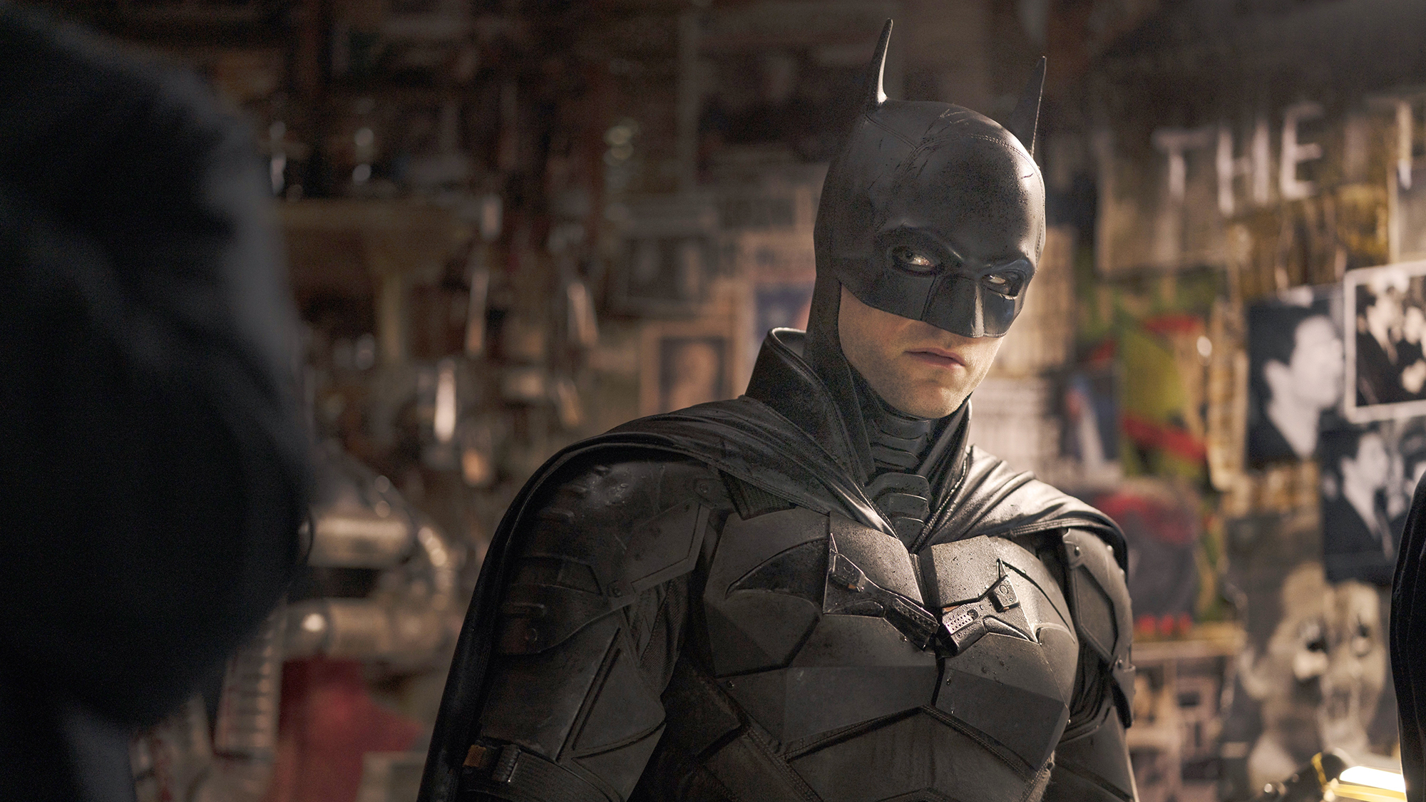 Alt Text: Batman standing amdst a crime scene