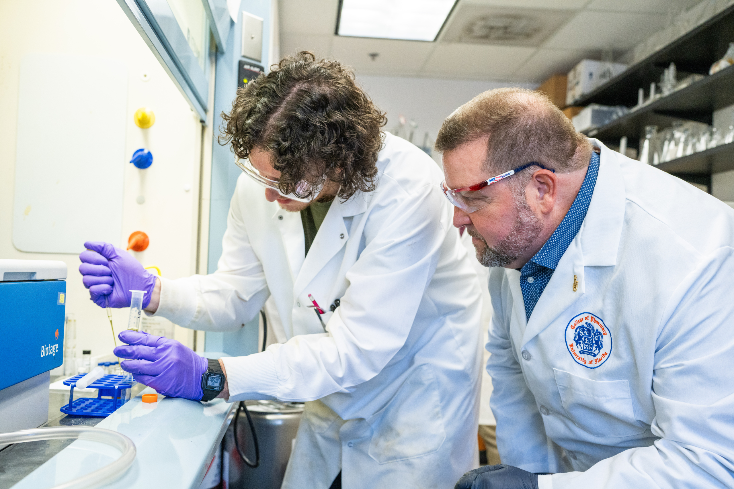 Dr. Chris McCurdy, right, in the lab. Photo from the University of Florida.