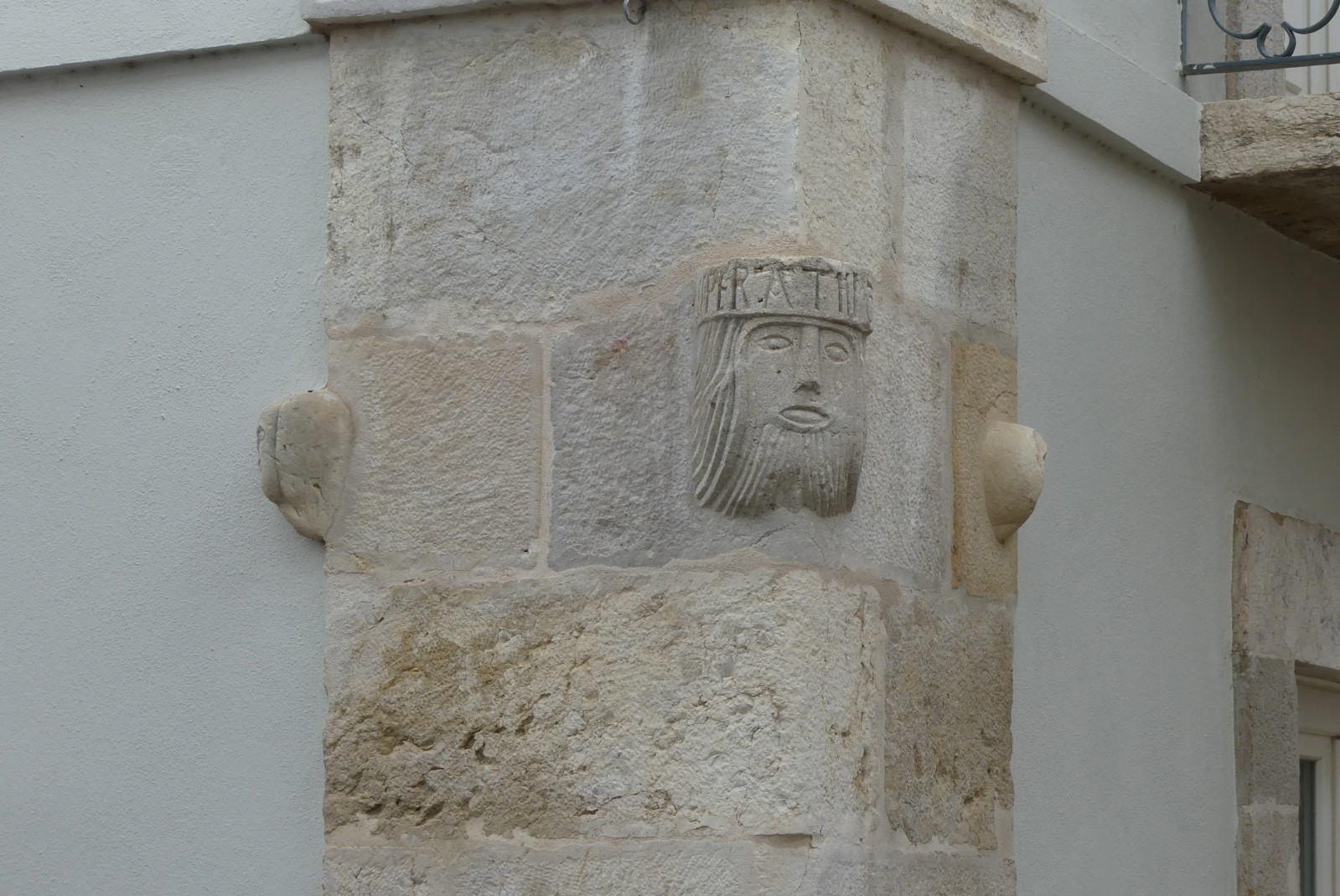 View from the corner of the building where 3 of the 4sculpted heads can be seen.